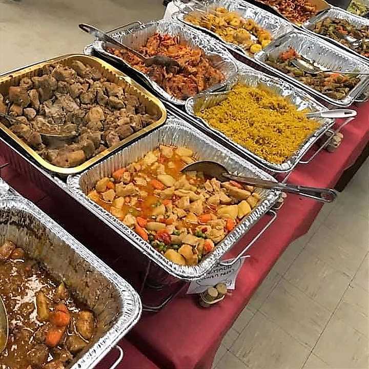 Trays of food on serving table
