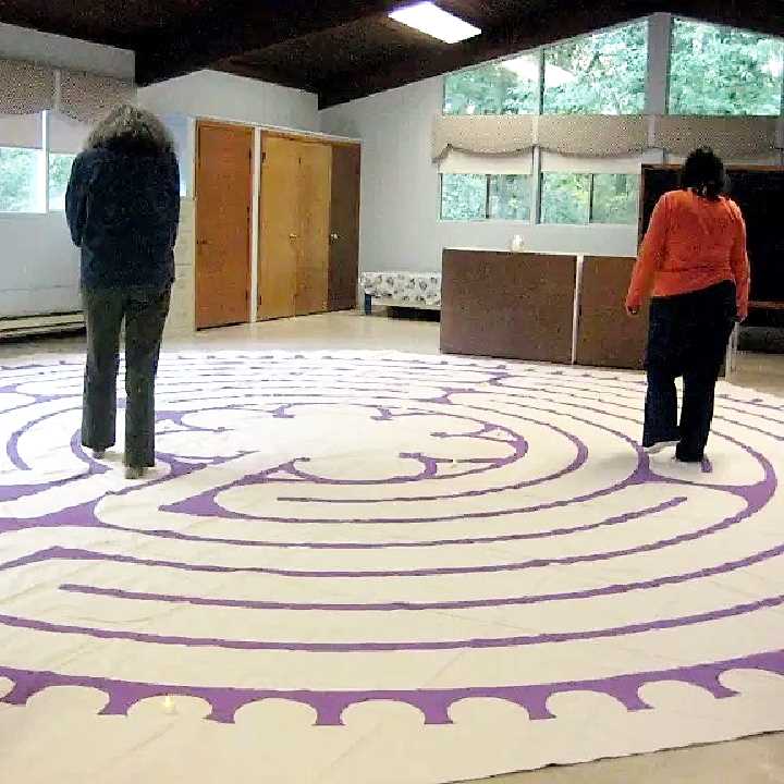 Women walking labyrinth in fellowship hall