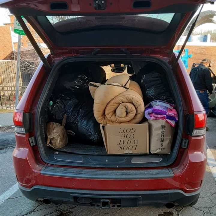 SUV filled with bags of clothing